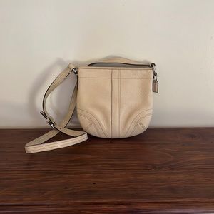 Gently used cream coach bag